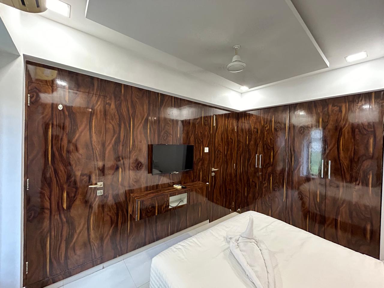 Bedroom TV and wardrobe